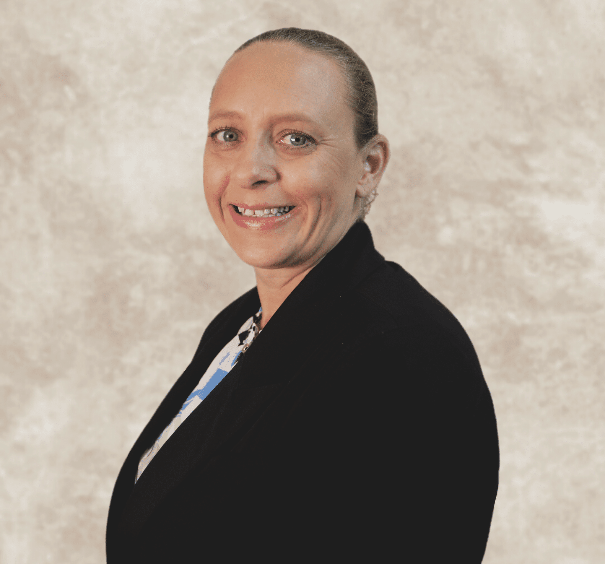 Haley Knighten, attorney at Kingwood, smiling in professional attire against a soft background, representing her dedication to family and criminal law.